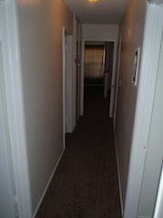 Hallway From Bedrooms to Living Room Dining Area & Kitchen